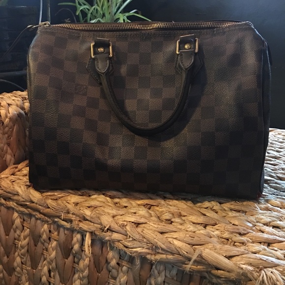 Louis Vuitton Vintage Speedy 30 Tote, $999, farfetch.com